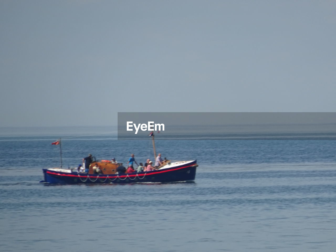VIEW OF BOAT IN SEA AGAINST CLEAR SKY