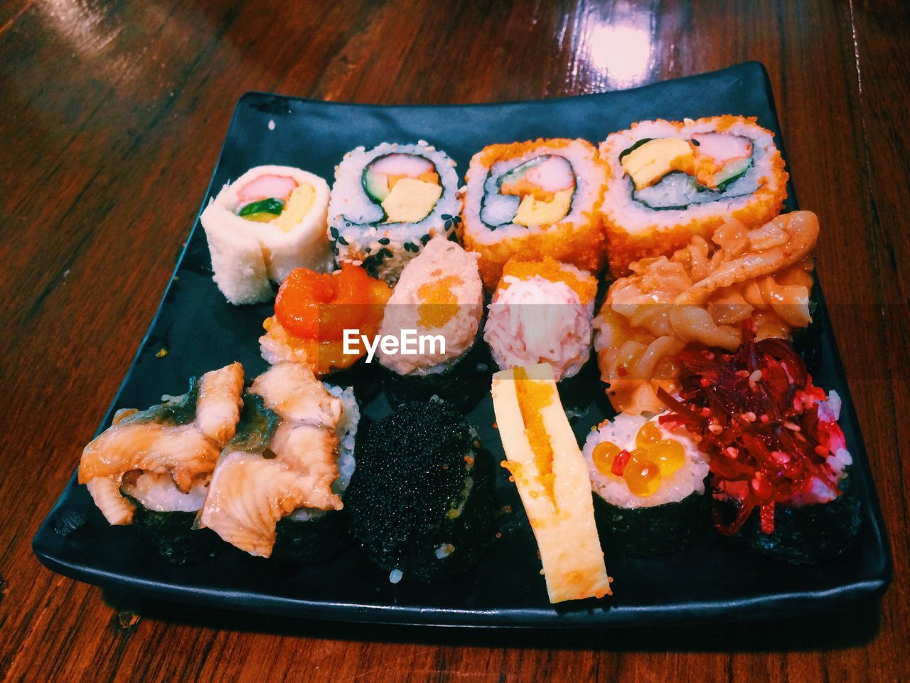 HIGH ANGLE VIEW OF SUSHI ON TABLE