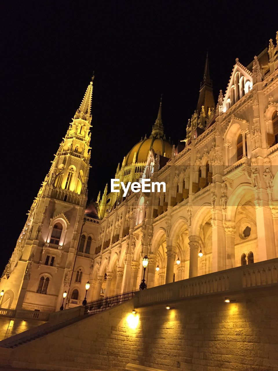 LOW ANGLE VIEW OF ILLUMINATED CATHEDRAL