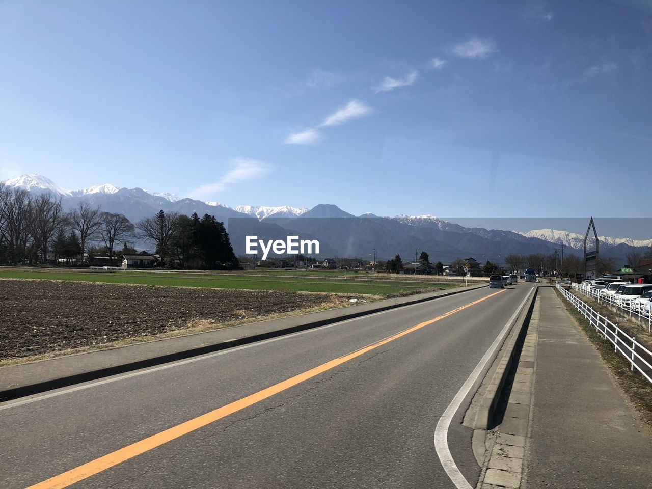 Road by mountain against sky