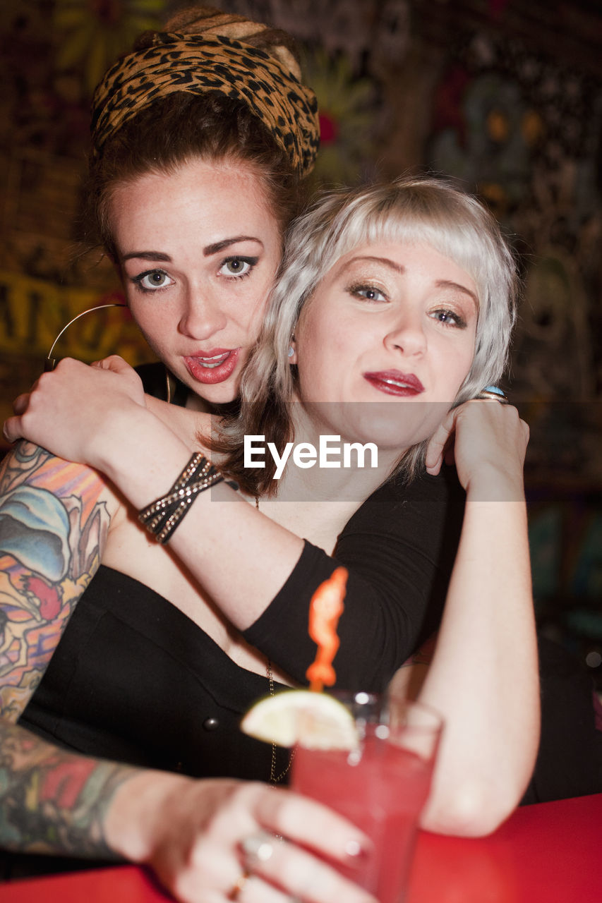 Young women hanging out at a bar