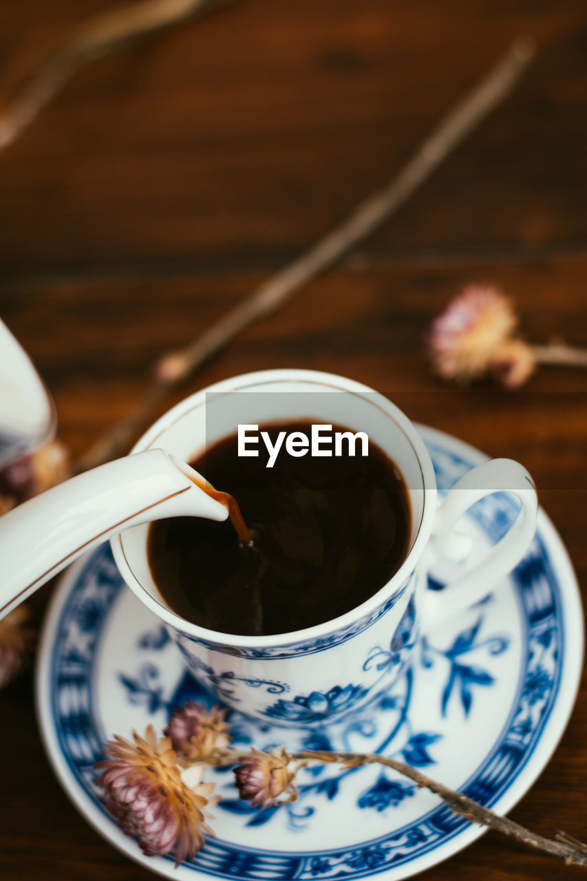 Close-up of coffee cup on table