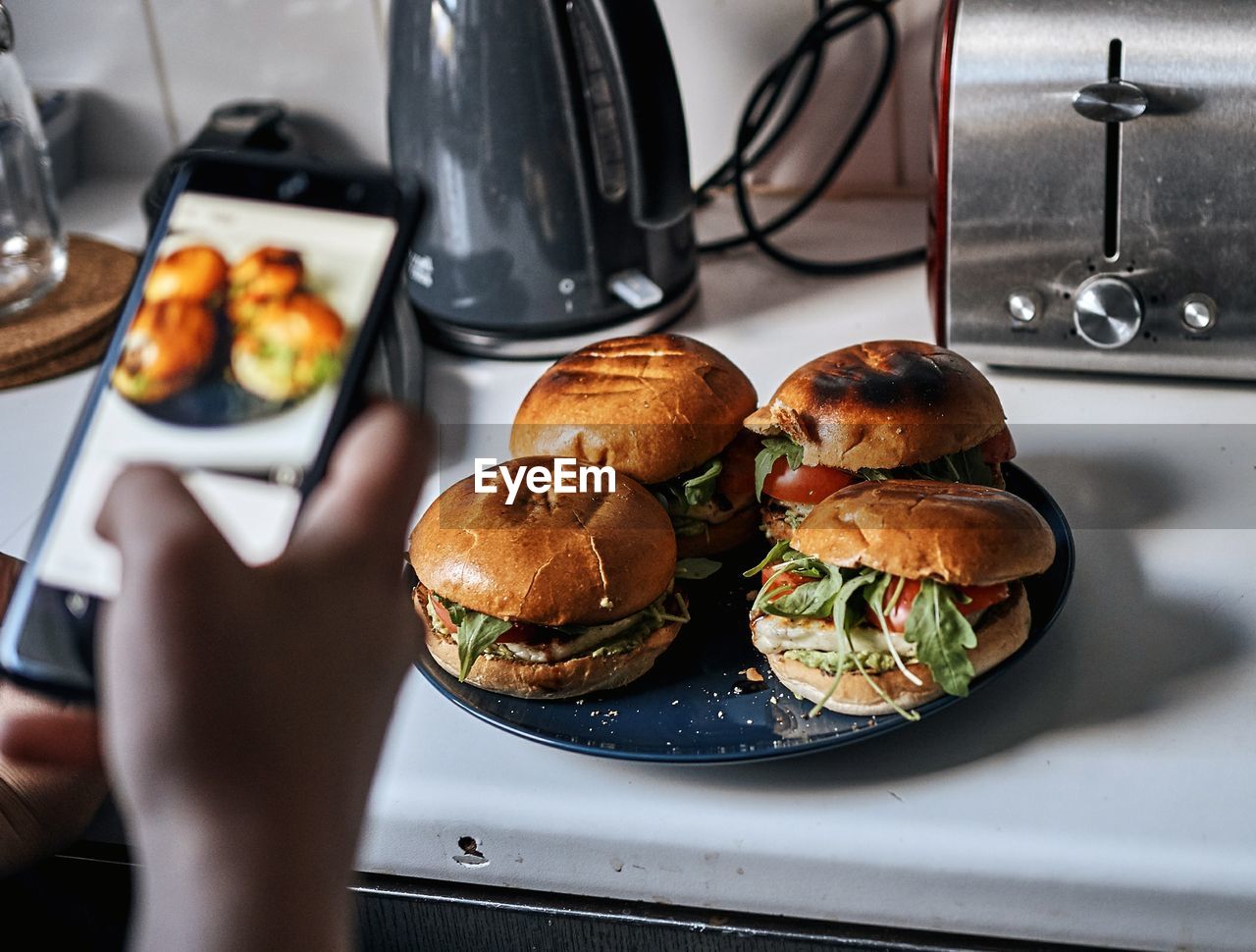 Close-up of man photographing food