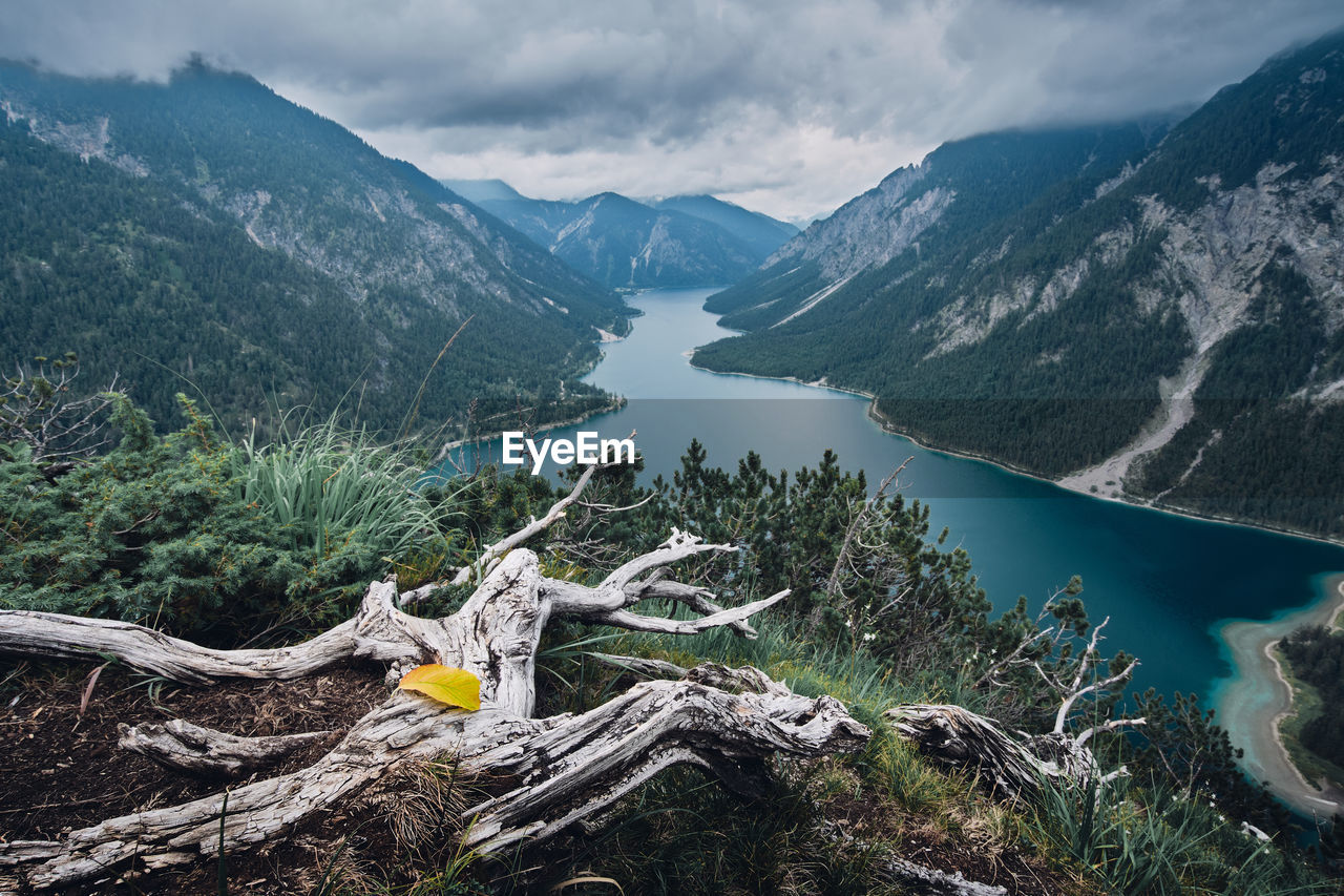 Scenic view of lake and mountains against sky