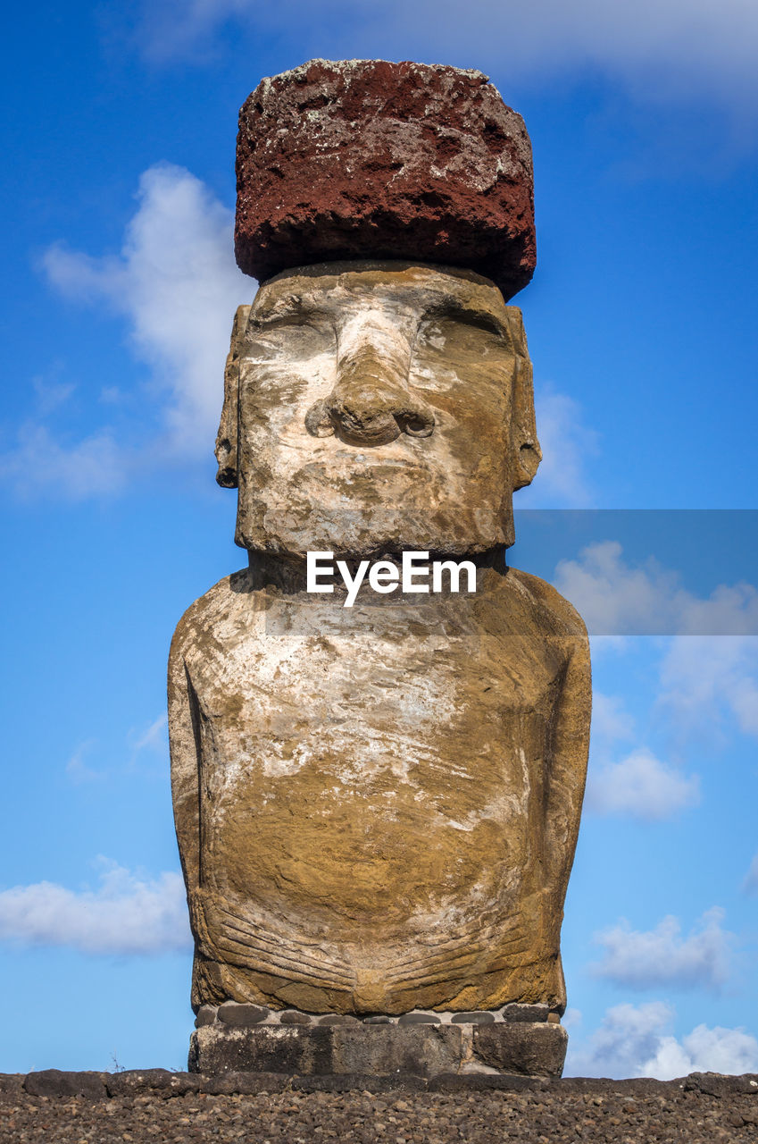 LOW ANGLE VIEW OF STACK OF STATUE AGAINST SKY