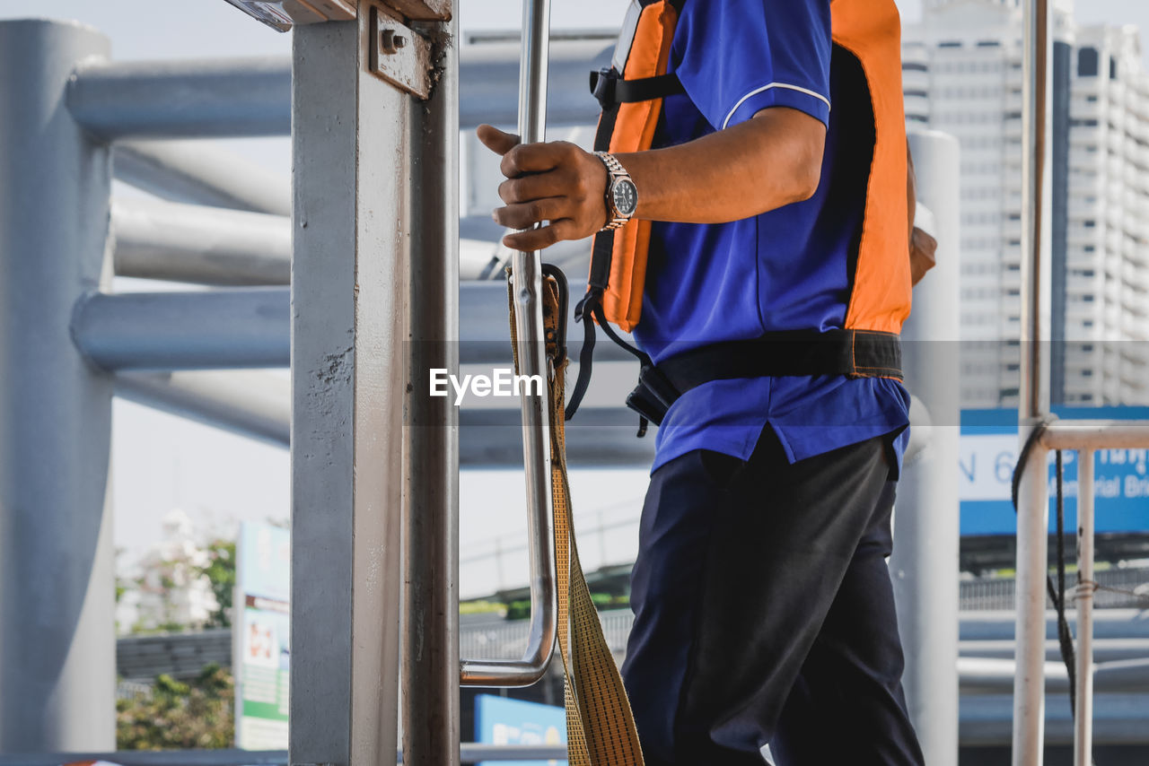 Man working on railing