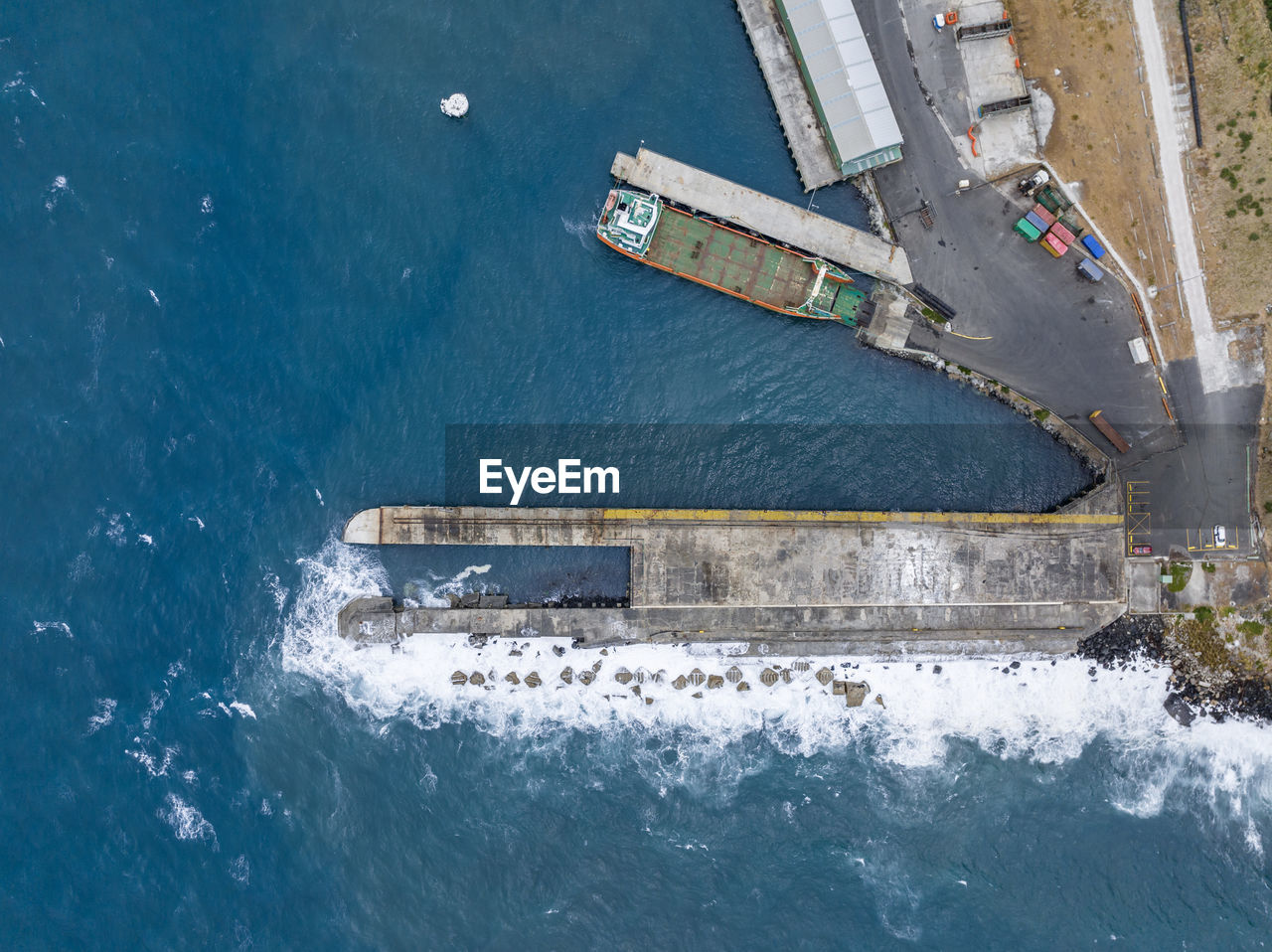 Bird's eye view of the harbour of stanley with a breakwater sea wall pier, tasmania, australia.