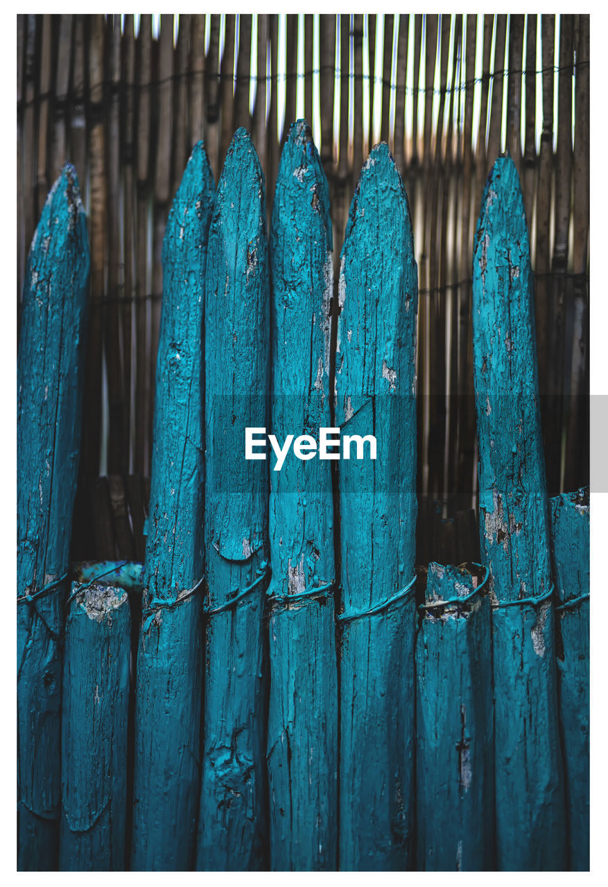 Close-up of blue wooden fence