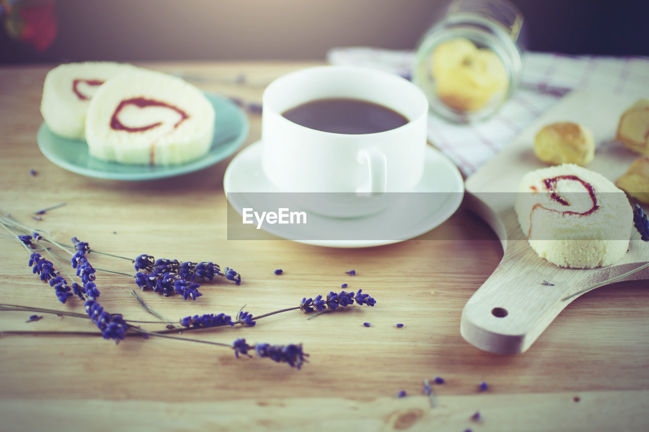 Close-up of coffee and cake on table