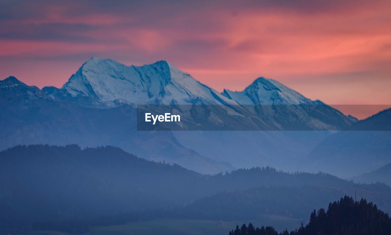 Scenic view of mountains against sky during sunset