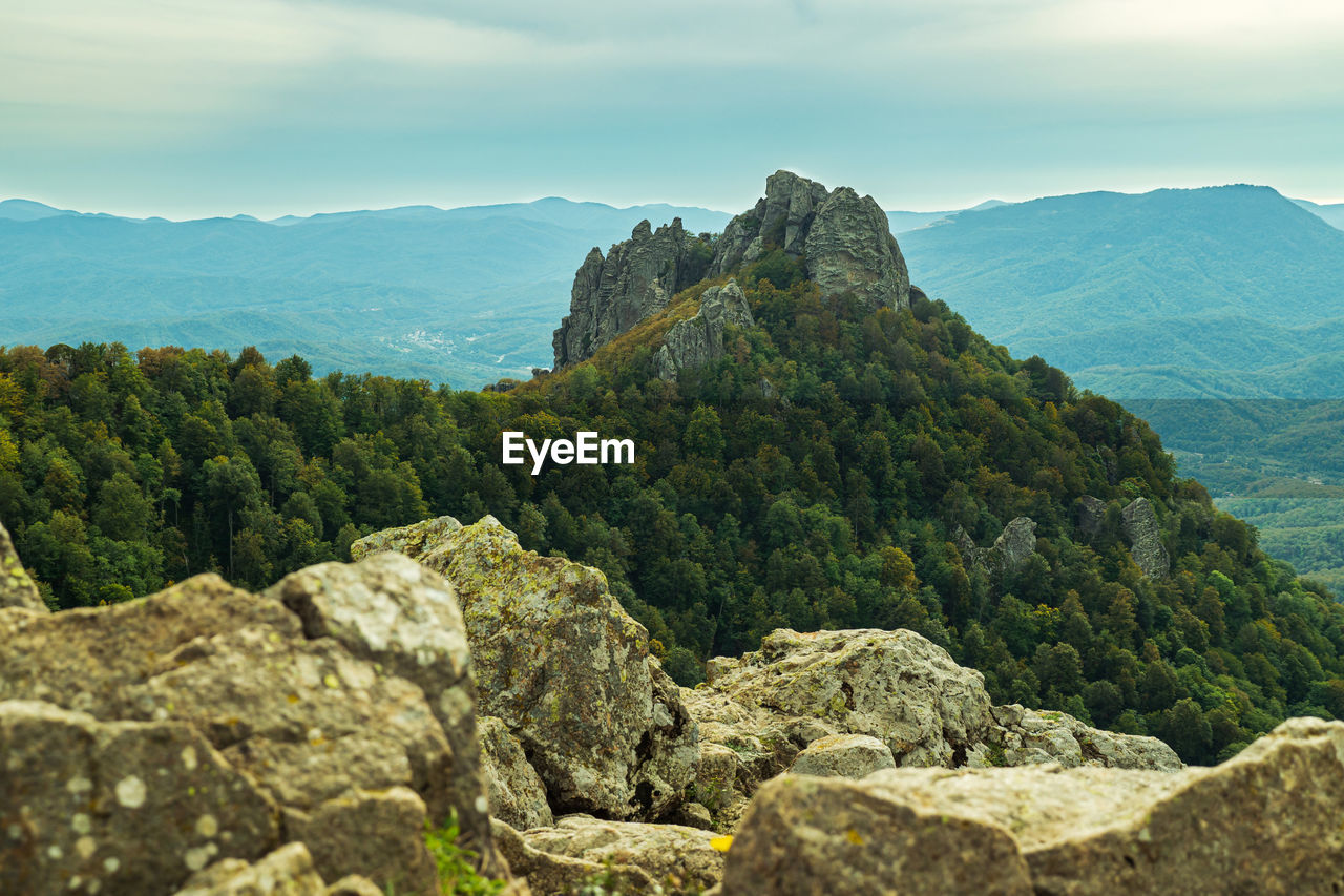 Panoramic view of rocky mountains against sky