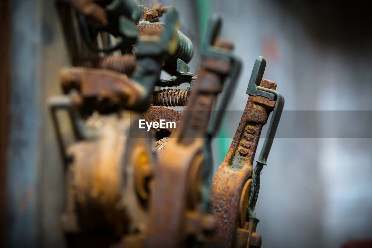 Close-up of rusty machine in factory