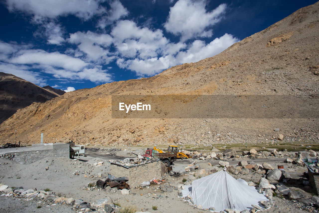 Scenic view of mountains against sky during sunny day