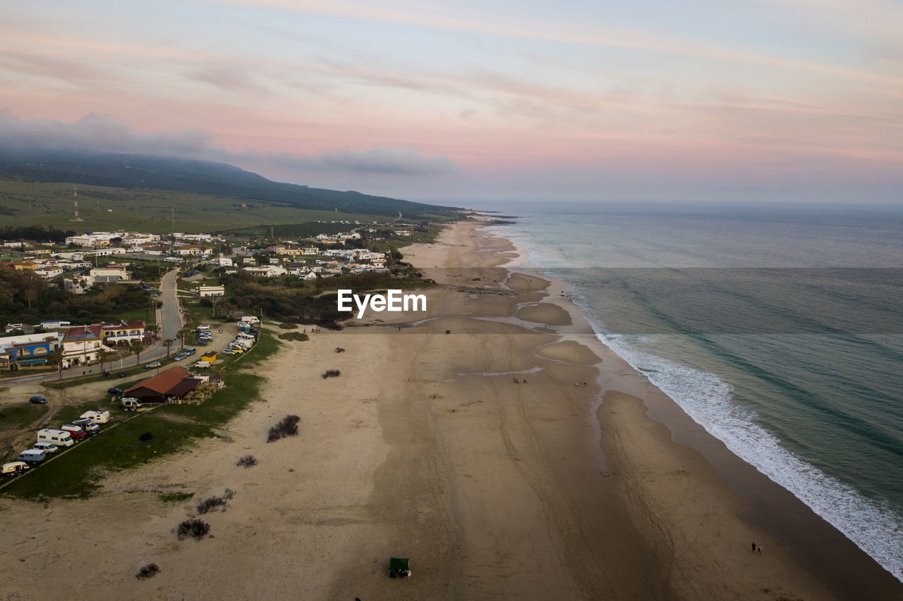 High angle view of beach against sky during sunset