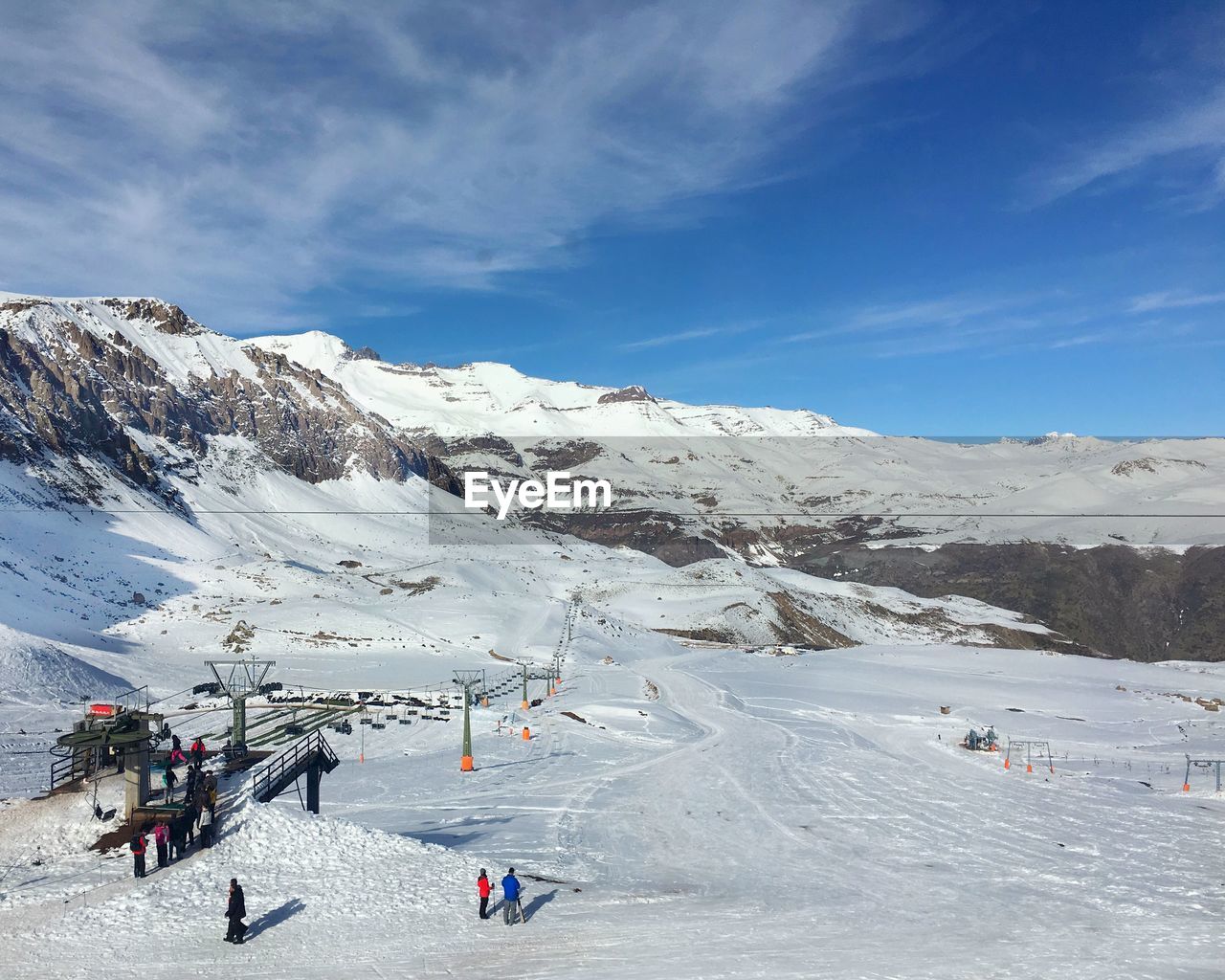 Tourists on snow covered landscape