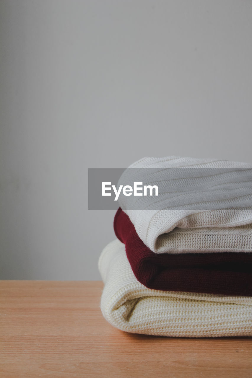 close-up of towels on table against wall