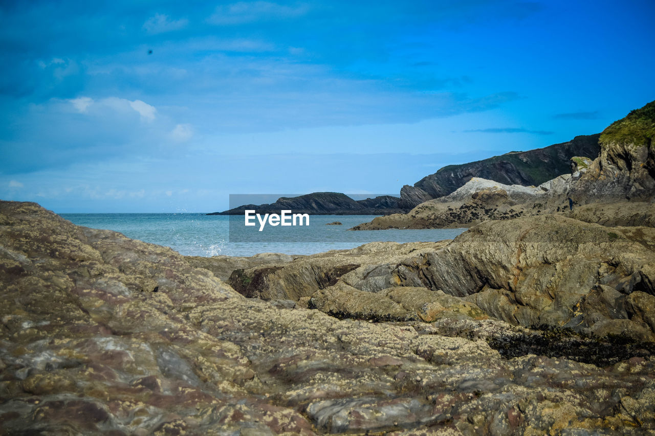 Scenic view of sea against blue sky