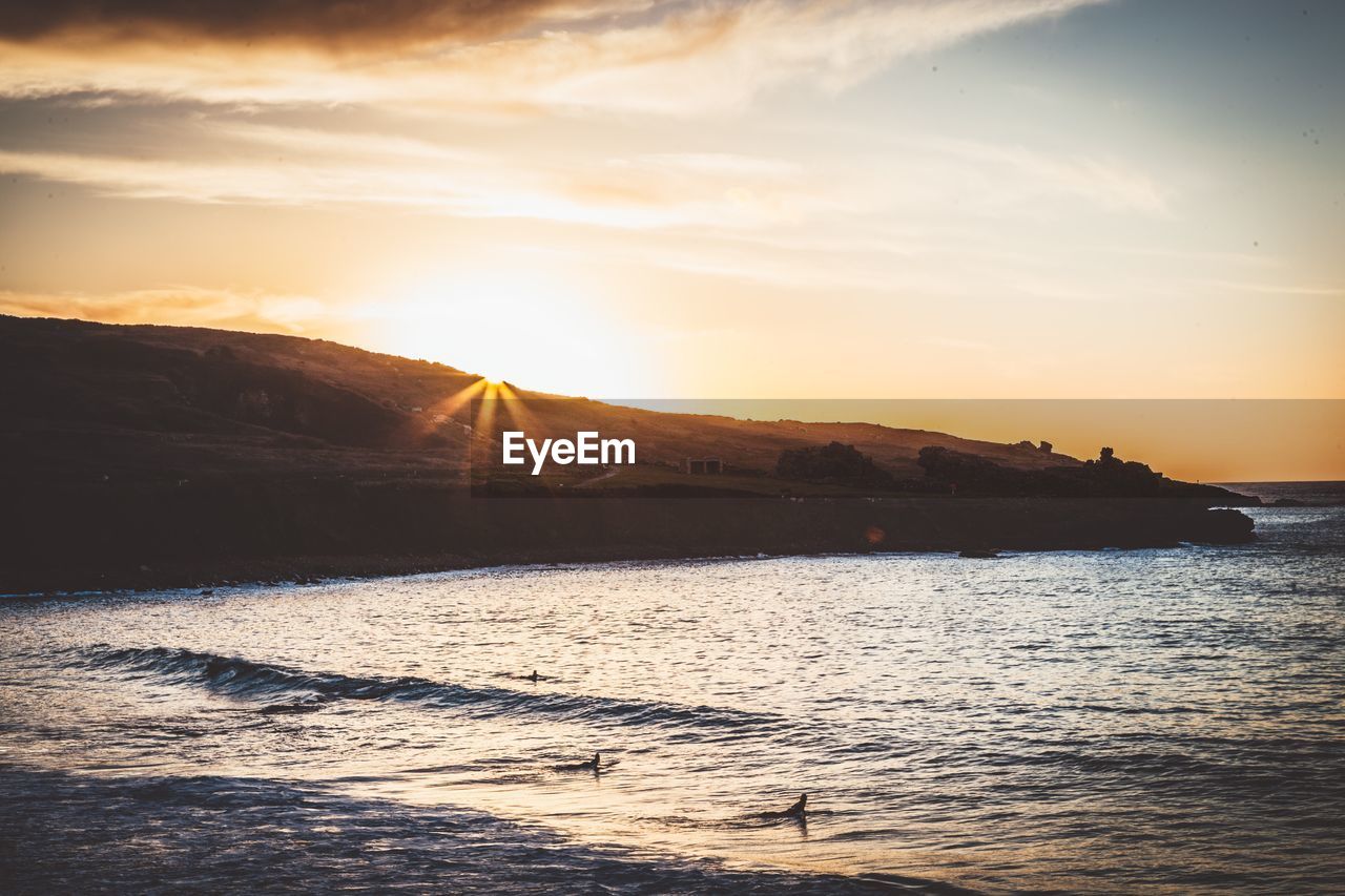 Scenic view of sea against sky during sunset