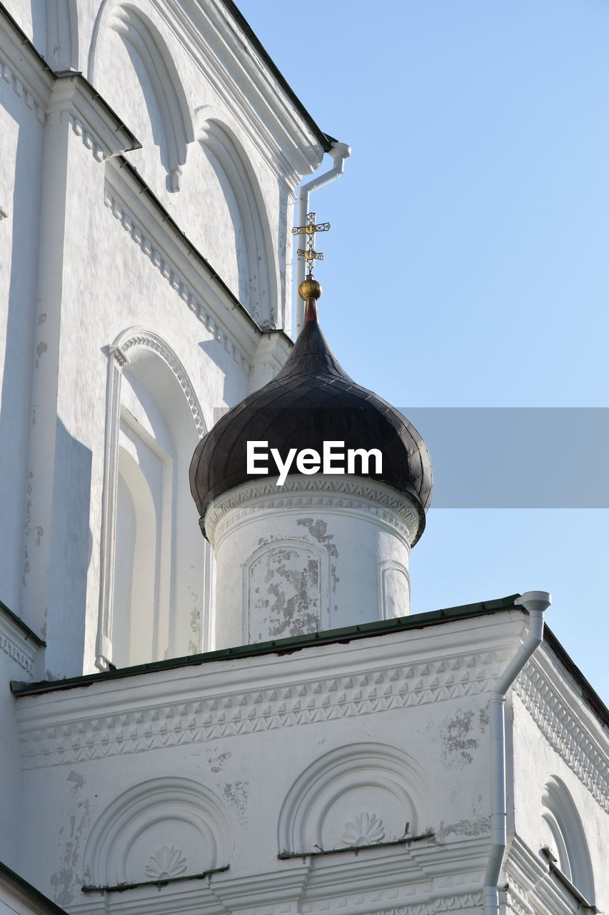 Low angle view of white building against clear sky