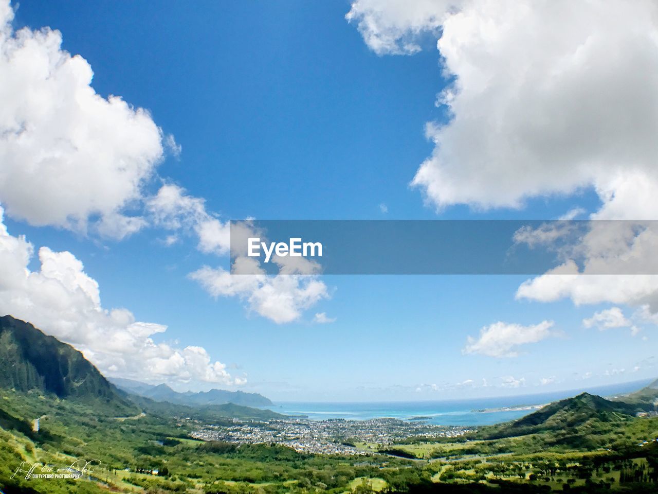 PANORAMIC VIEW OF GREEN LANDSCAPE AGAINST SKY