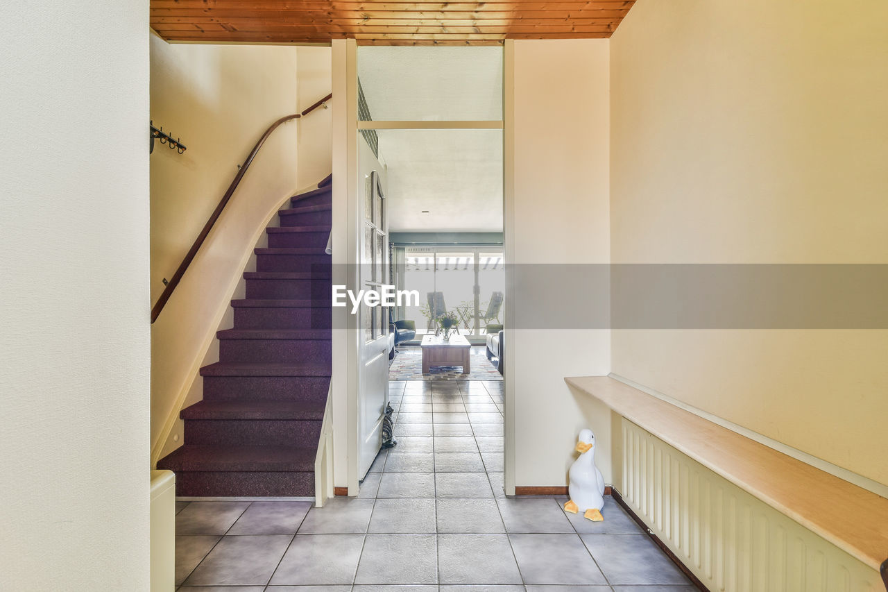 rear view of man walking on steps