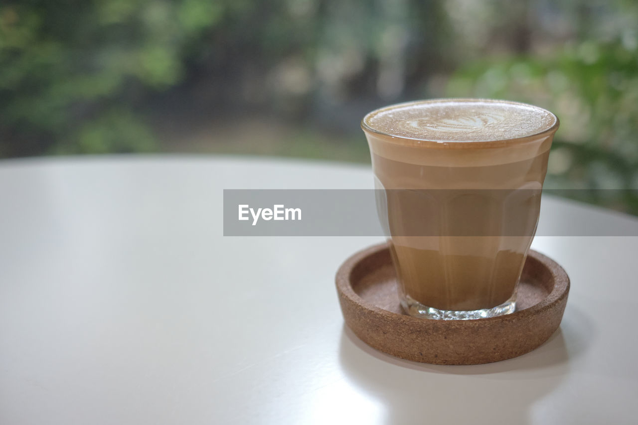 Close-up of coffee cup on table