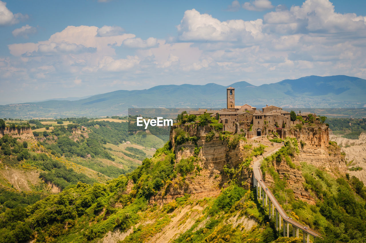 CASTLE ON LANDSCAPE AGAINST SKY