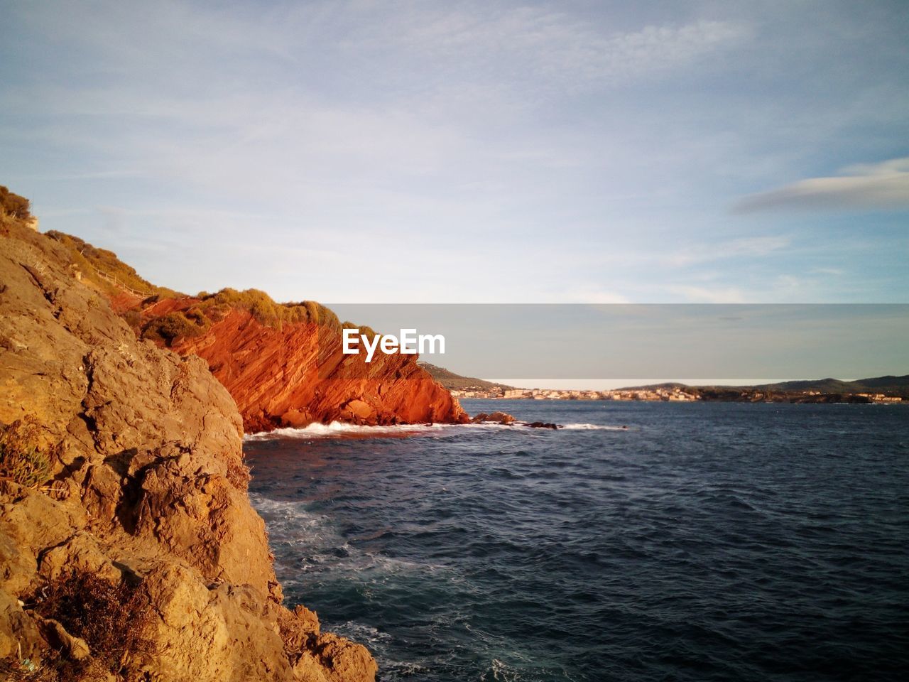 SCENIC VIEW OF CLOUDY SKY OVER SEA AND MOUNTAINS