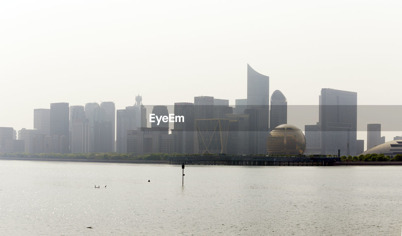 VIEW OF BUILDINGS IN CITY AGAINST SKY