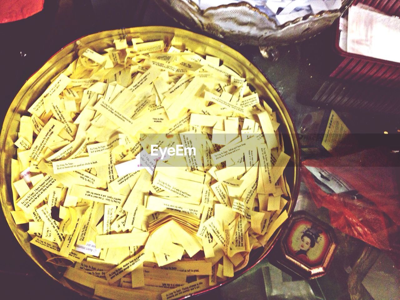 High angle view of fortune papers in container