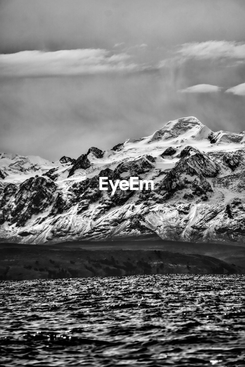 mountain, black and white, snow, cold temperature, environment, cloud, monochrome photography, monochrome, scenics - nature, winter, landscape, beauty in nature, water, snowcapped mountain, sky, mountain range, sea, nature, horizon, ice, wave, no people, coast, travel destinations, white, travel, ocean, glacier, land, frozen, outdoors, tranquility, tranquil scene, polar climate, extreme terrain, rock, non-urban scene, tourism, day, remote