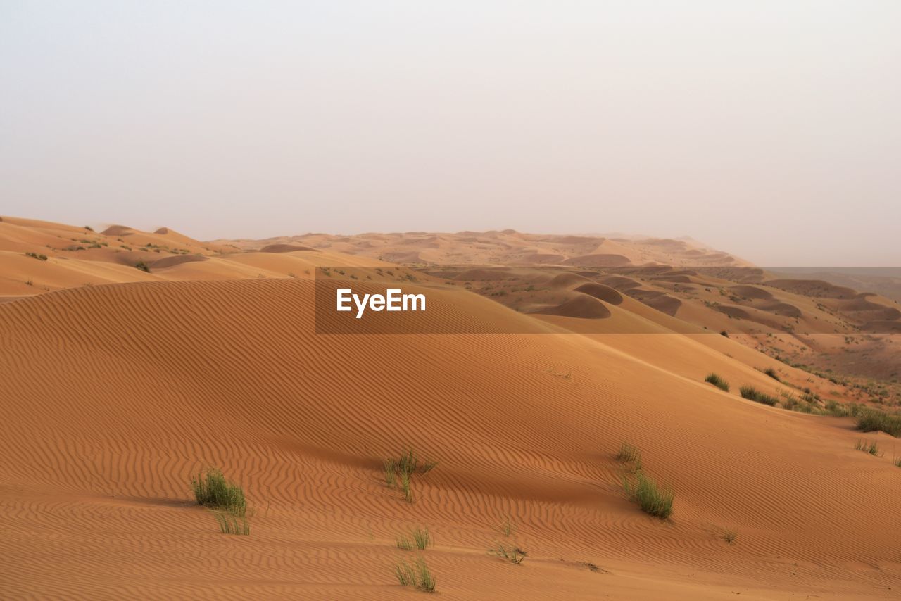 Scenic view of desert against clear sky