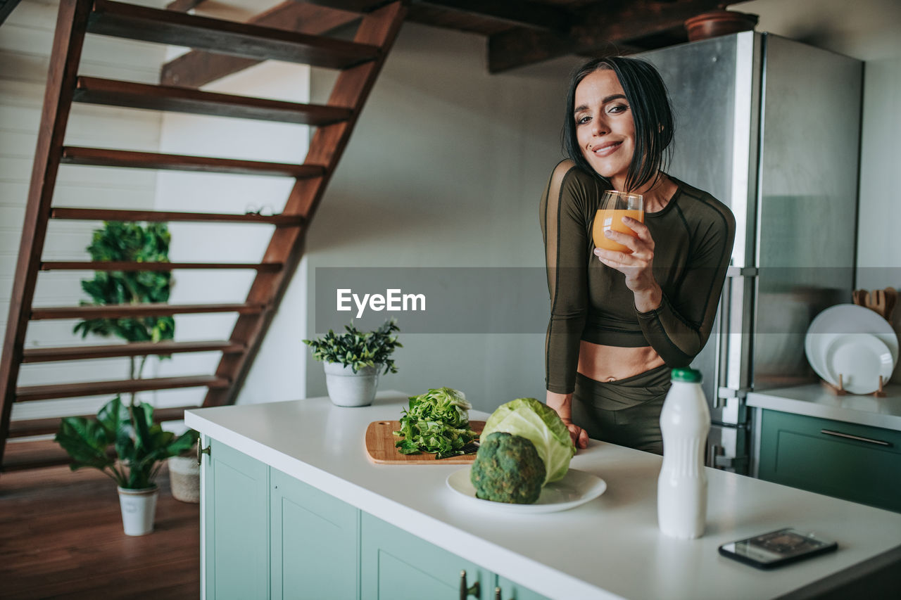 Woman holding food on table