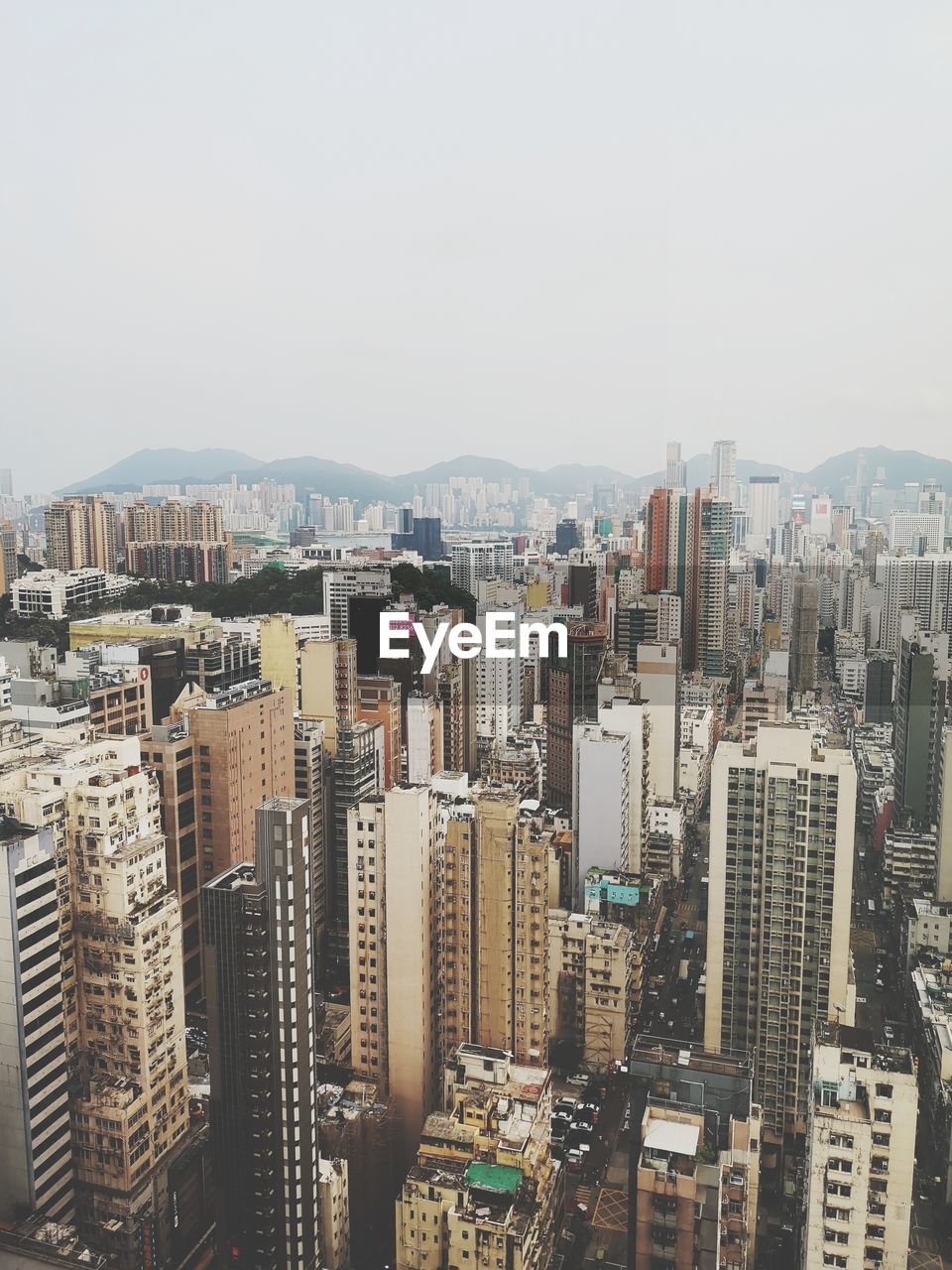 High angle view of buildings in city against clear sky