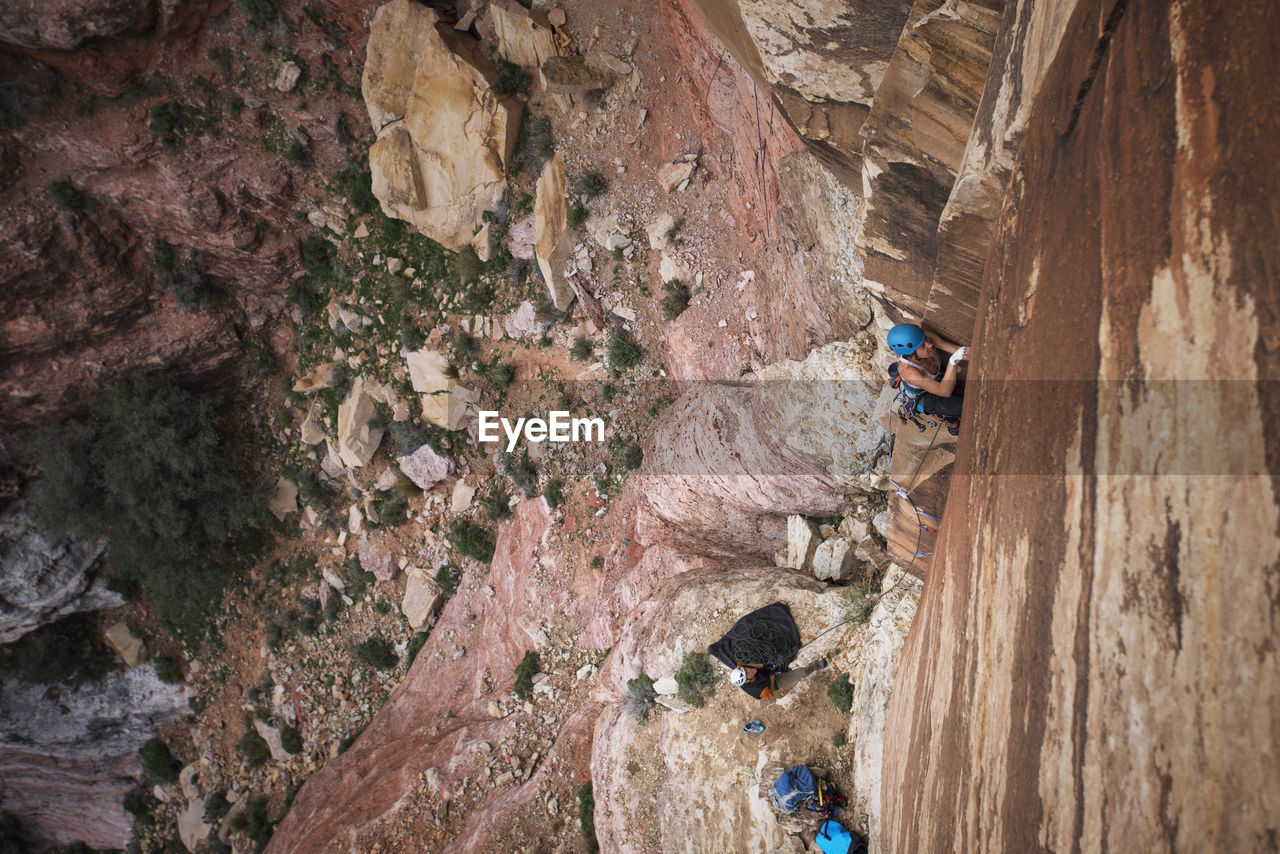 Female hiker climbing mountains at red rock canyon national conservation area