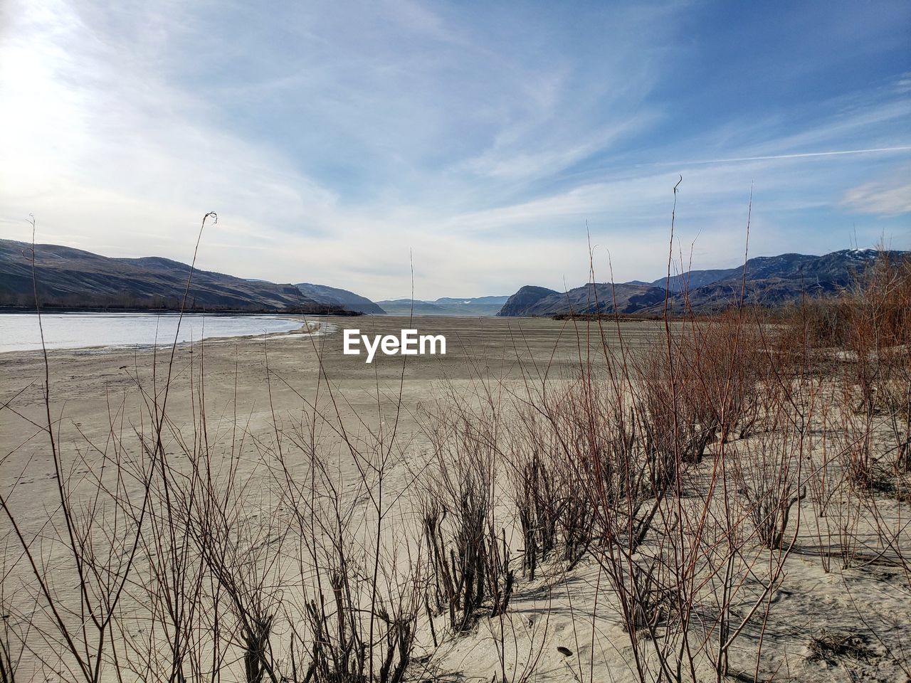 Scenic view of land against sky during winter