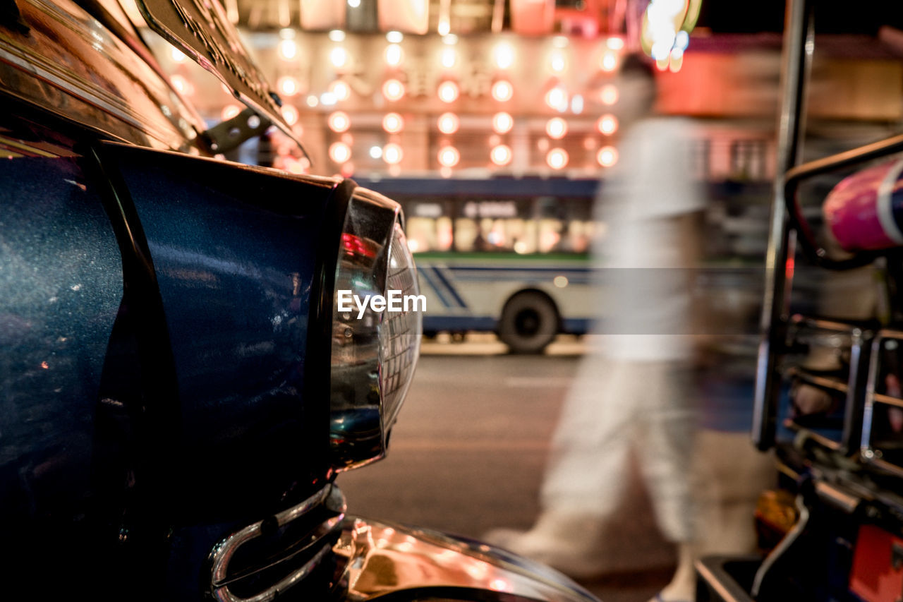 Close-up of car on road at night