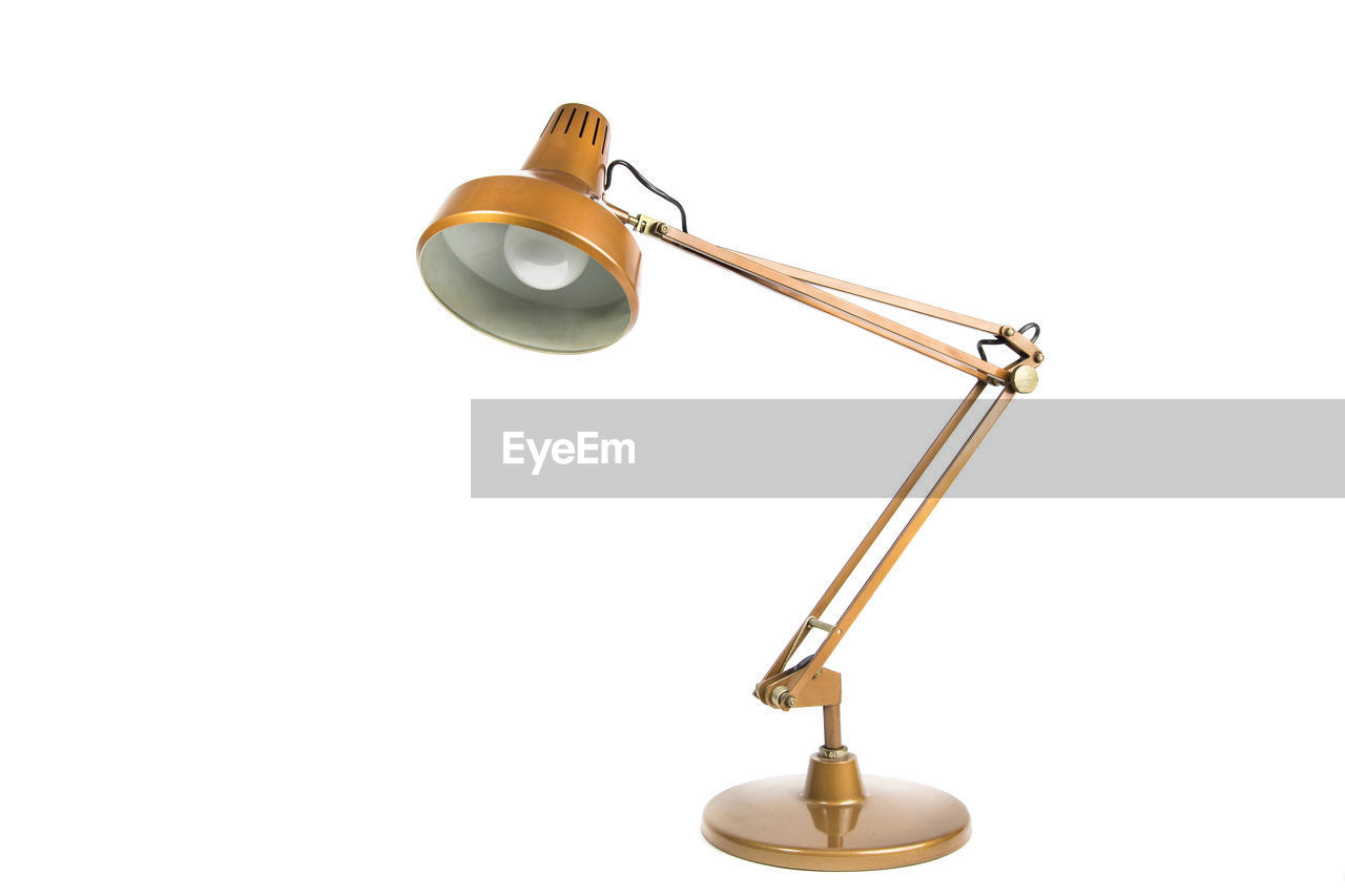 Close-up of electric lamp against white background