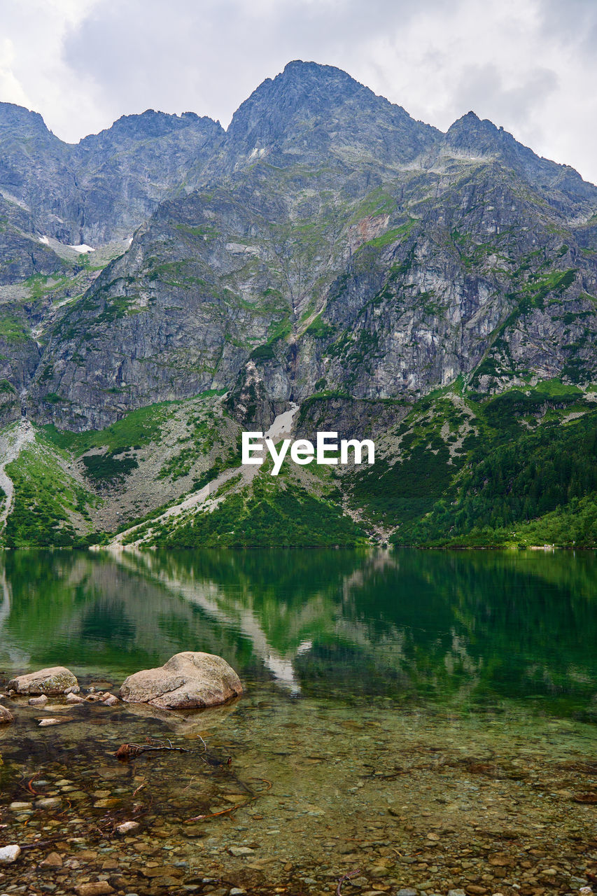 Mountains range near beautiful lake. tatra national park in poland. morskie oko or sea eye lake