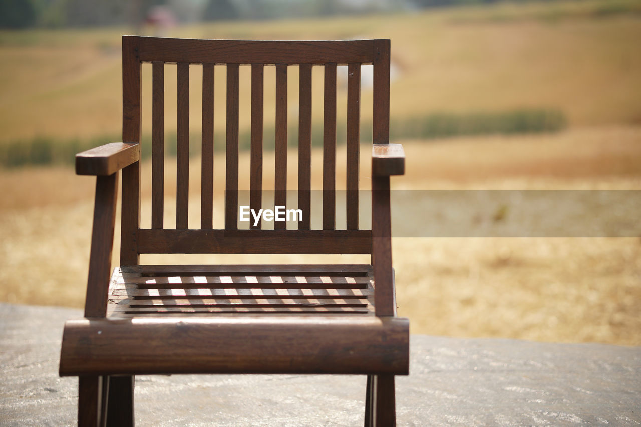 EMPTY BENCH ON FIELD