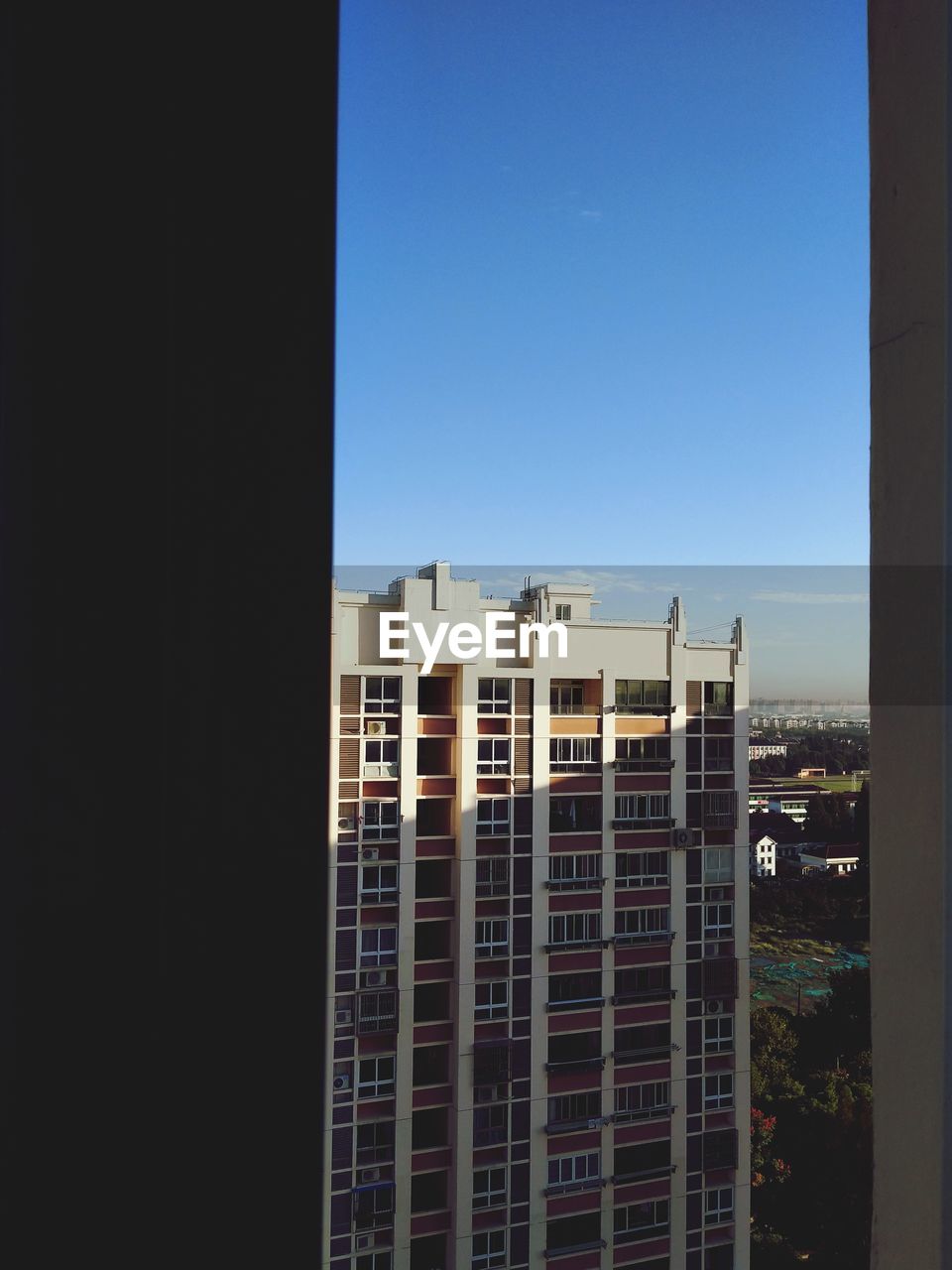 BUILDINGS AGAINST CLEAR SKY