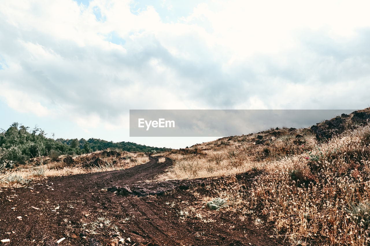 sky, cloud, environment, landscape, soil, nature, mountain, scenics - nature, land, plant, no people, non-urban scene, tree, beauty in nature, rock, outdoors, day, tranquility, rural area, travel, travel destinations, tranquil scene, semi-arid, field, desert