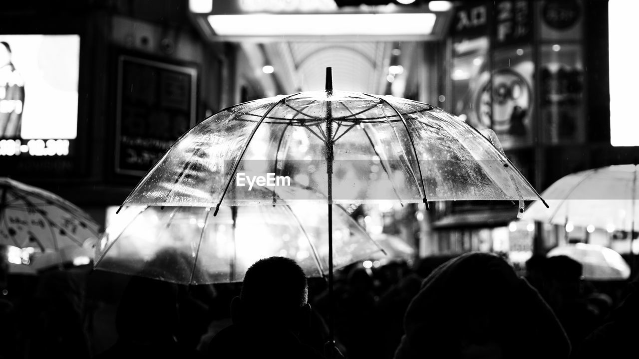 GROUP OF PEOPLE IN RAIN