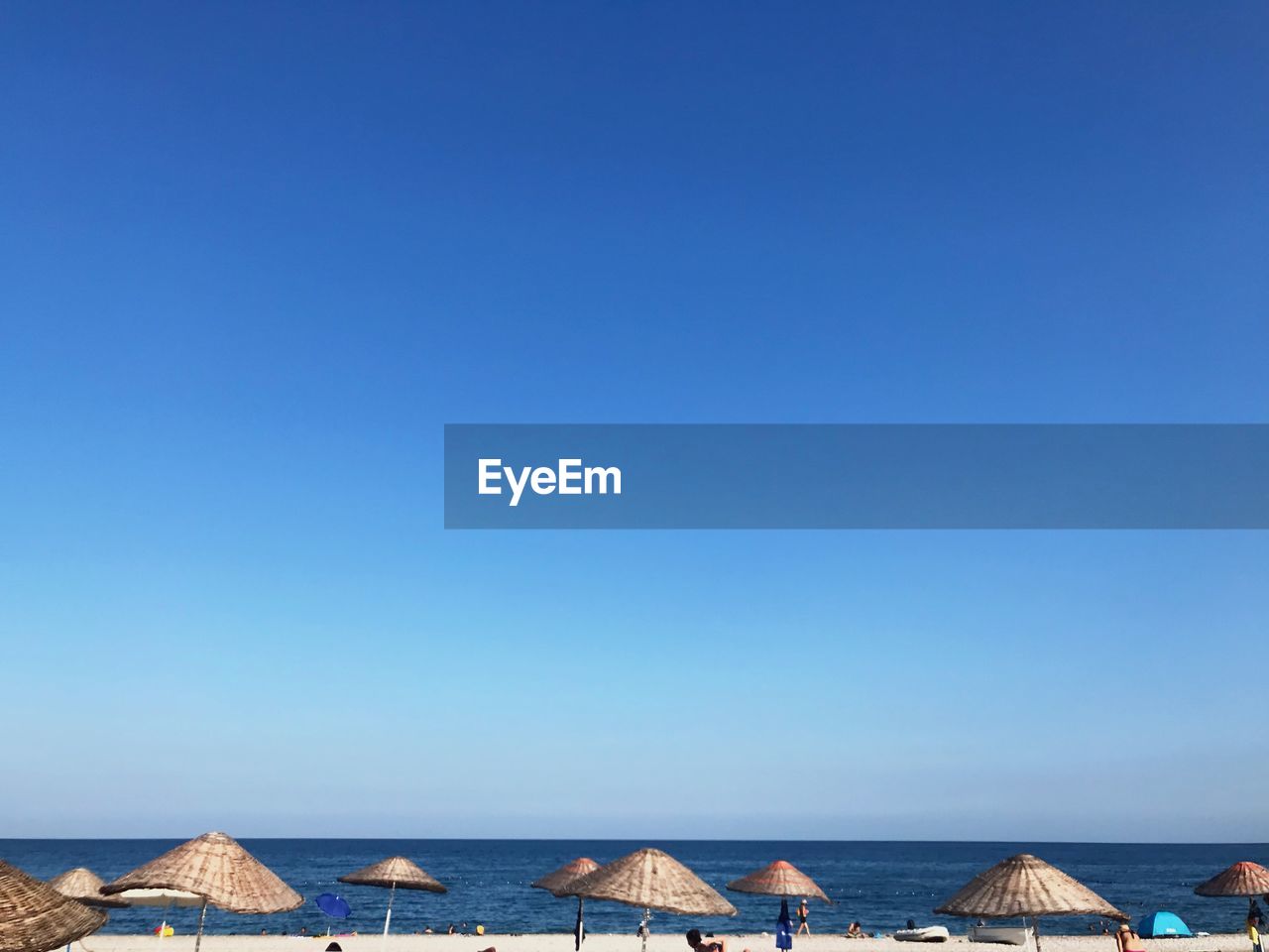 Panoramic view of sea against clear blue sky