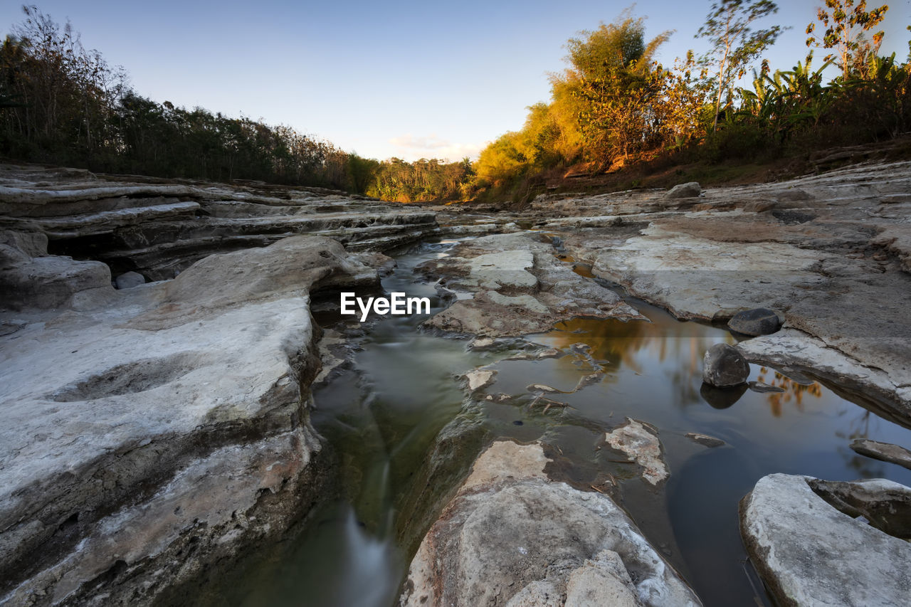 Scenic view of river stream against sky