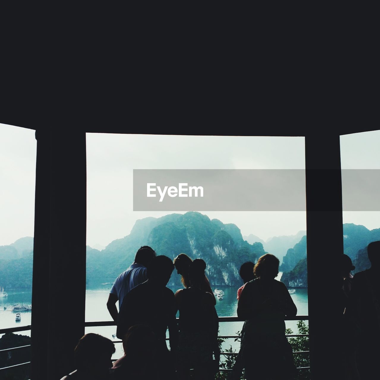 People at observation point against halong bay