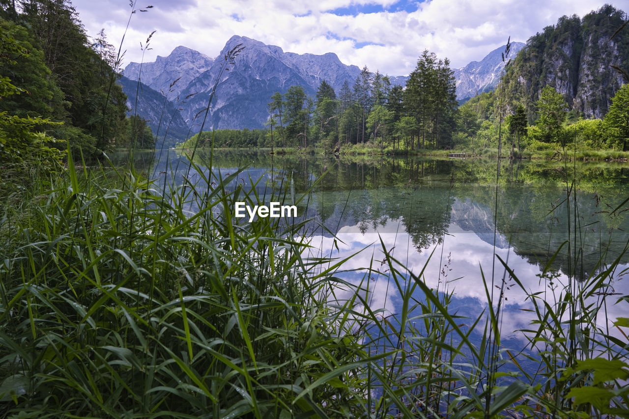 Scenic view of lake and mountains against sky