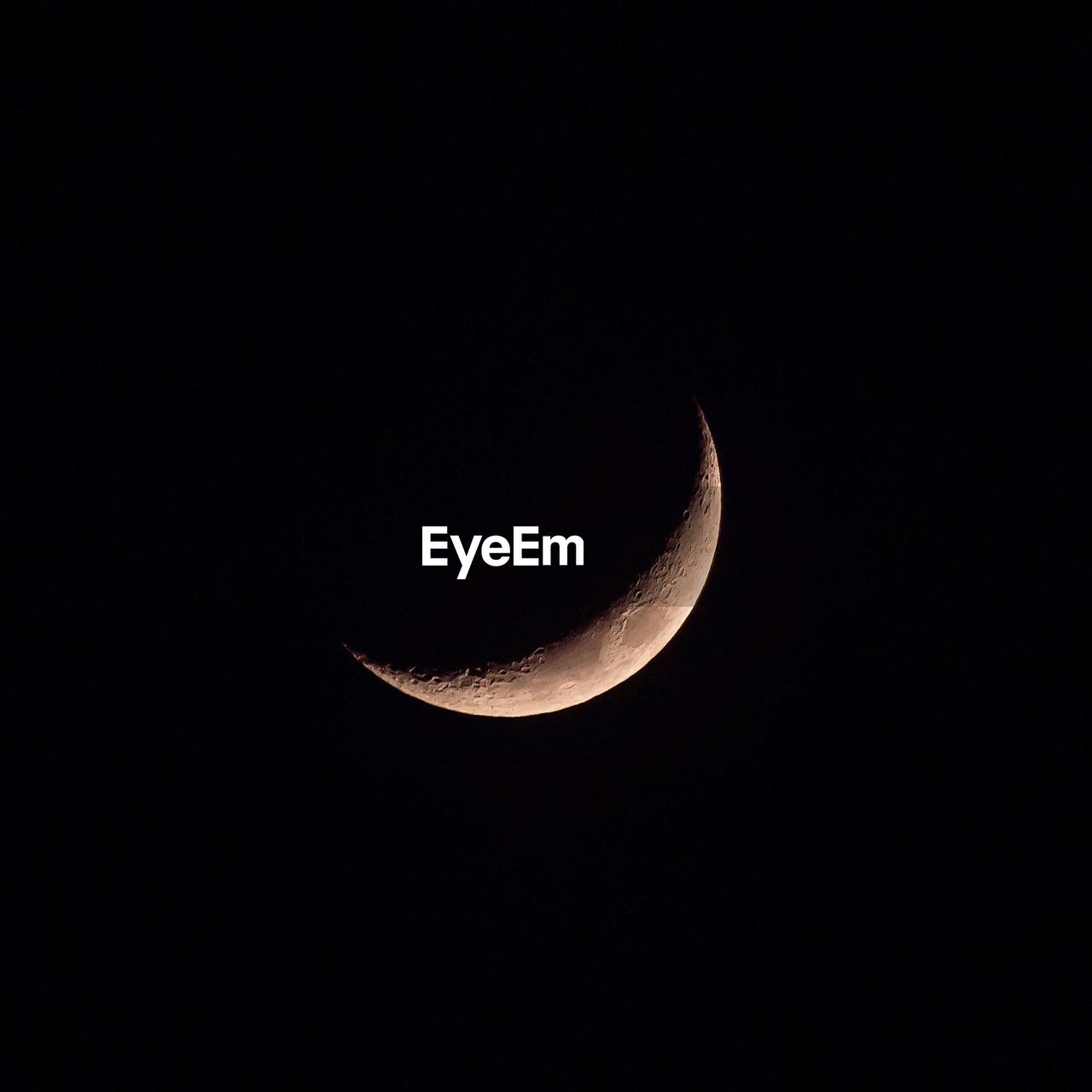 Low angle view of moon against sky at night