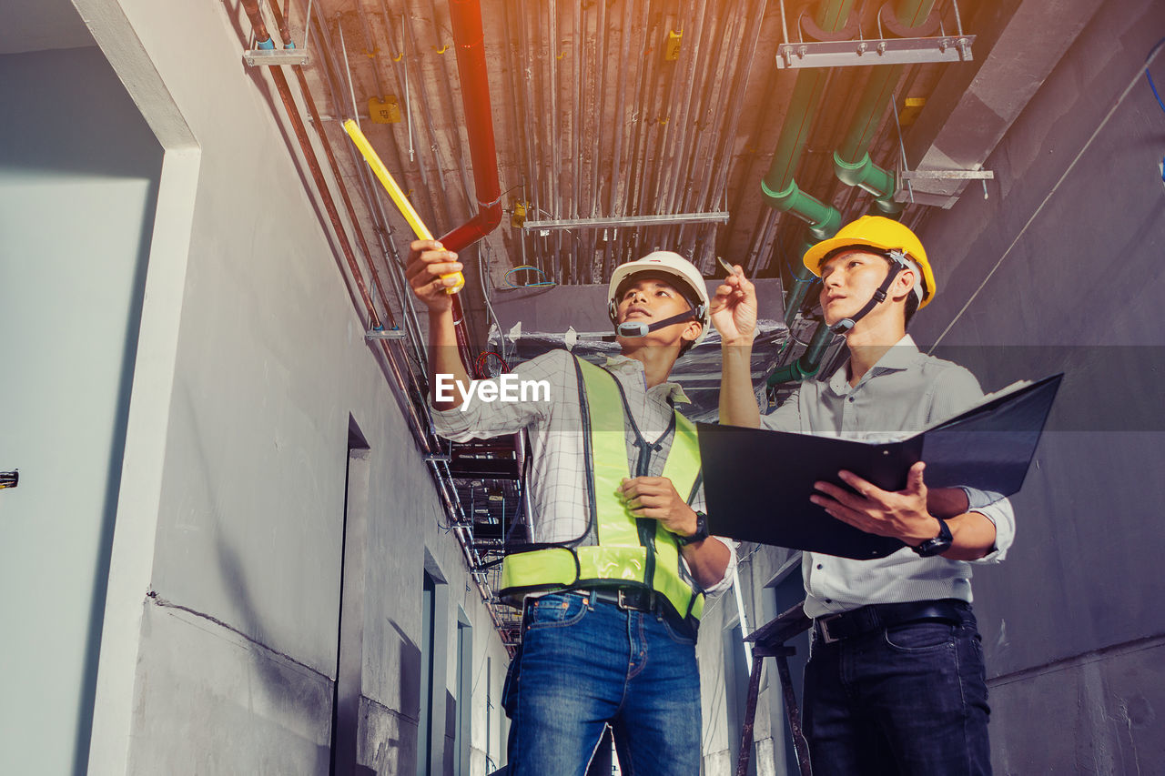 Project engineer, engineer and technician working on construction site