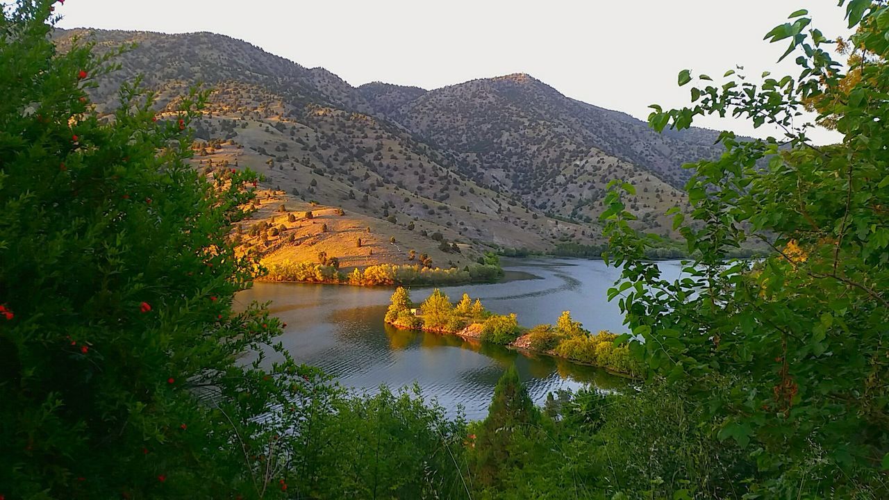 SCENIC VIEW OF RIVER AND MOUNTAINS